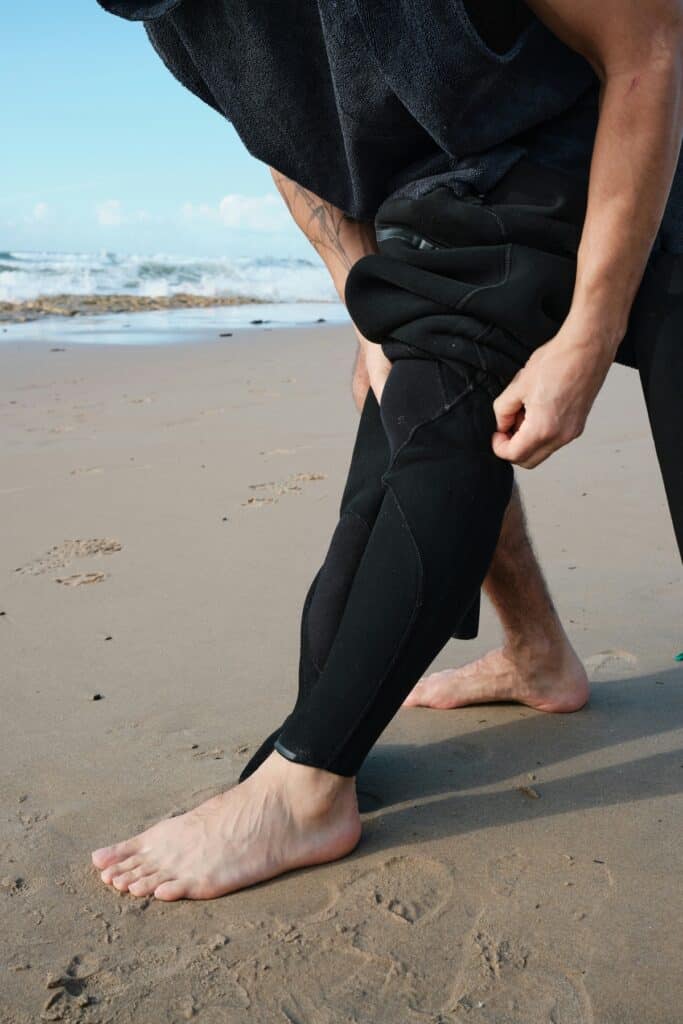 man fitting wetsuit
