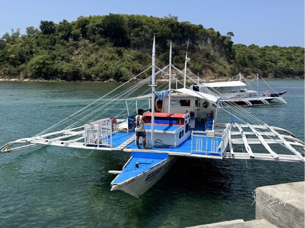 Private boat waiting at Maya Port for the crossing to Malapascua.